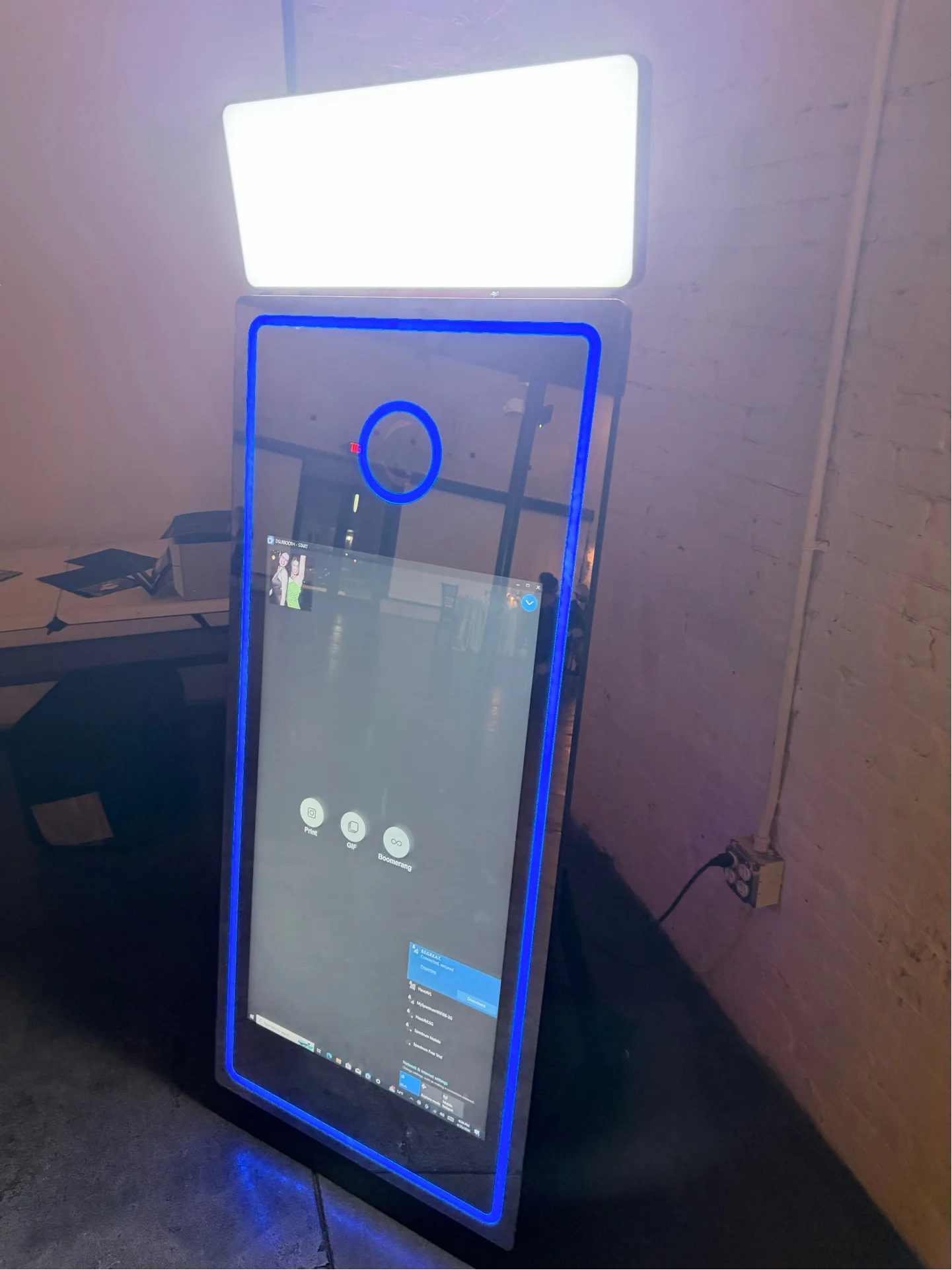DEMM Photo Booths mirror booth with custom branding at a corporate event in Orlando, Central Florida